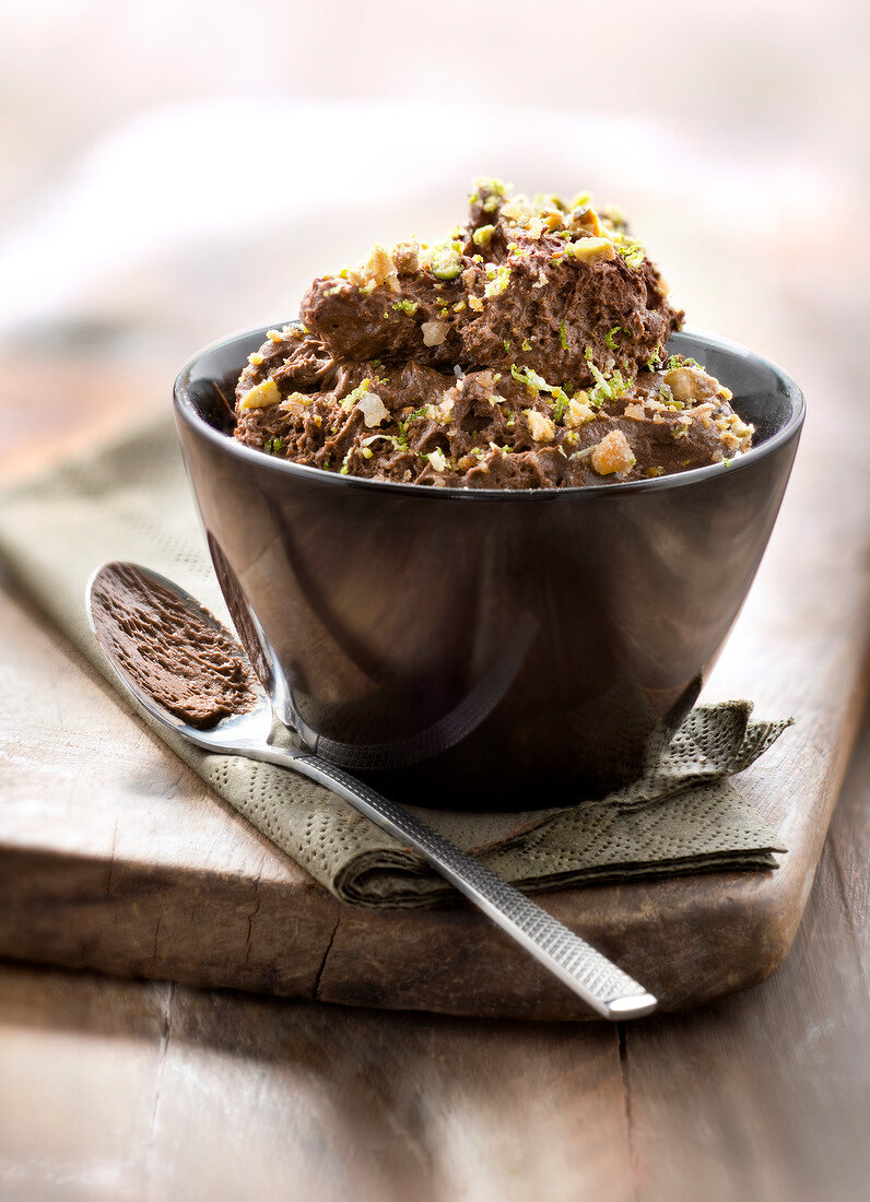 Chocolate mousse with lime zests and crushed pistachios