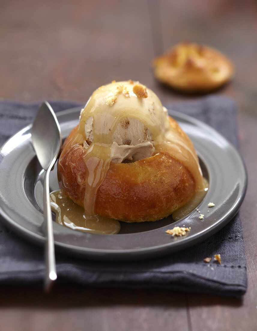Brioche garnished with almond ice cream and beer toffee sauce
