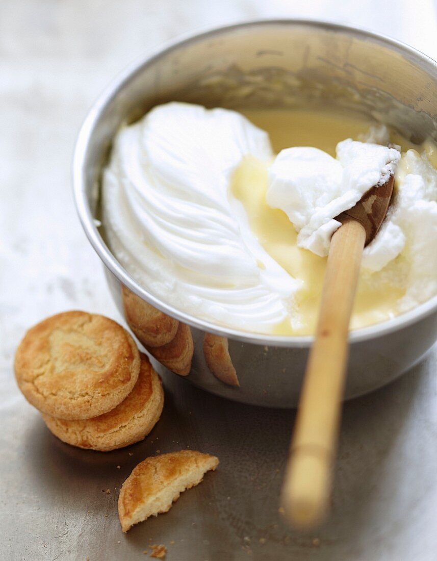 Blending together the whipped egg whites and the caramel