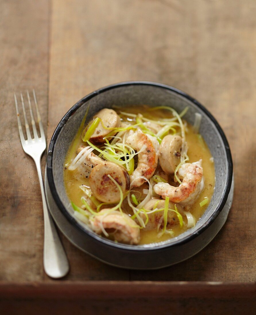 Pan-fried Dublin Bay prawns,white sausages and leeks with cider