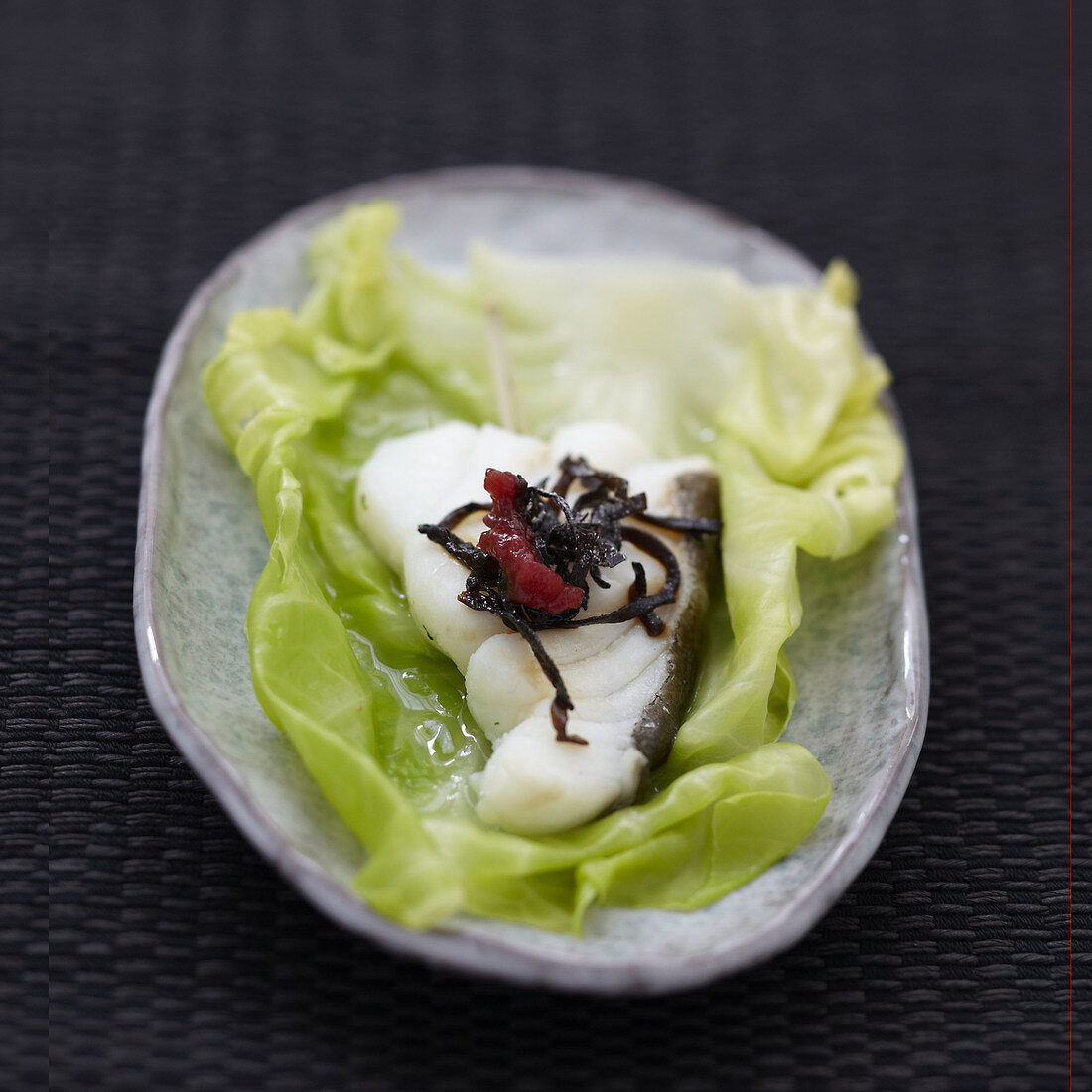 Cod steamed in a cabbage leaf