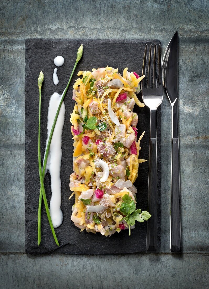 Fish tartare with mango and coconut