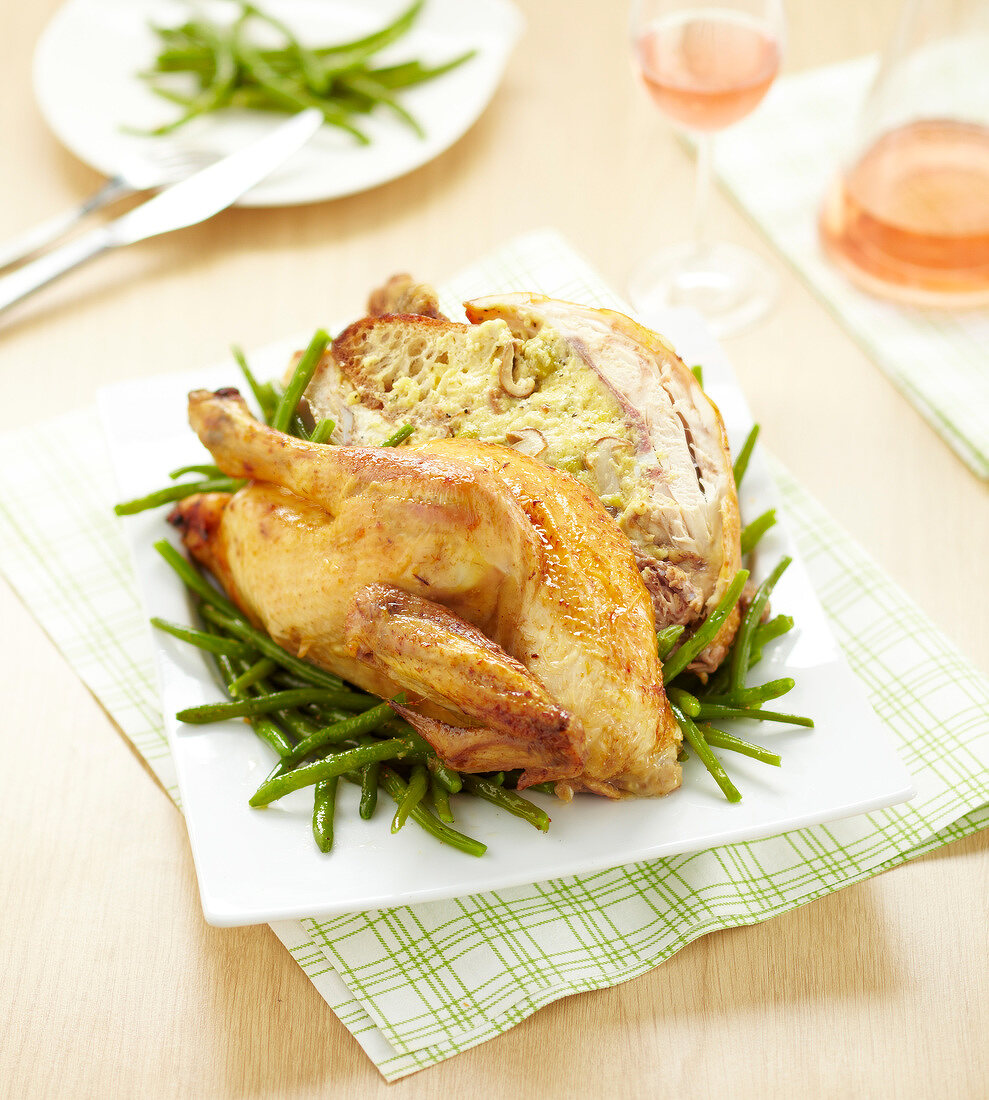 Roasted chicken stuffed with bread and mushrooms