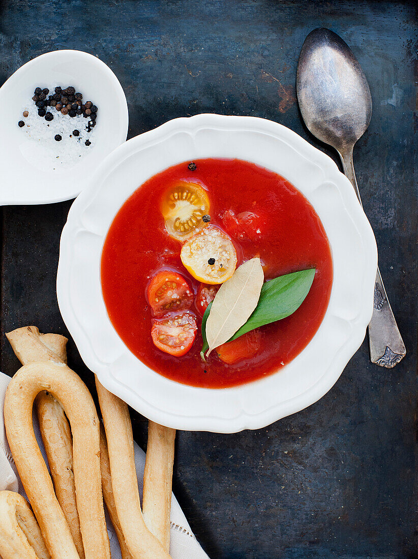 Tomato soup with yellow and red cherry tomatoes