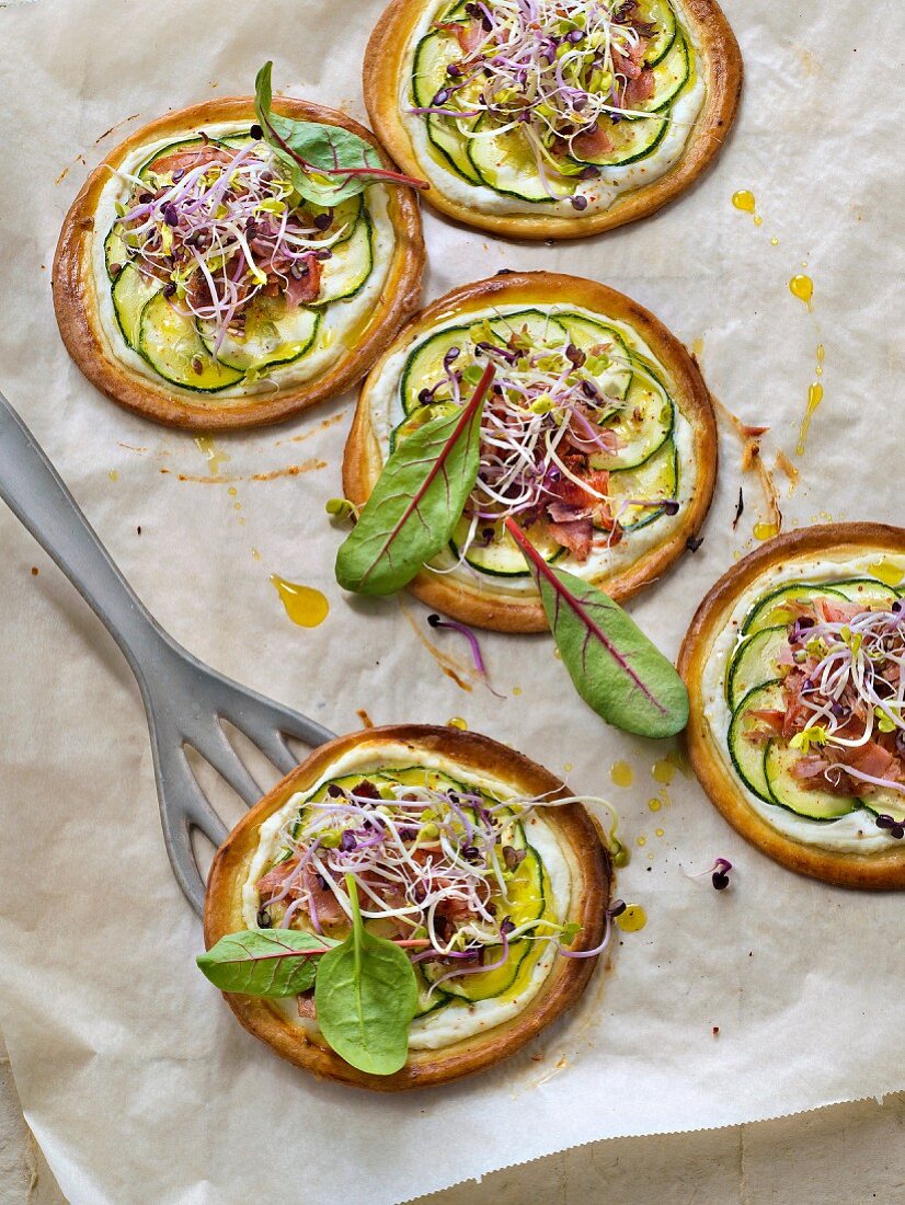 Thinly sliced zucchini,ricotta,sprout and crisp bacon thin pastry tarts