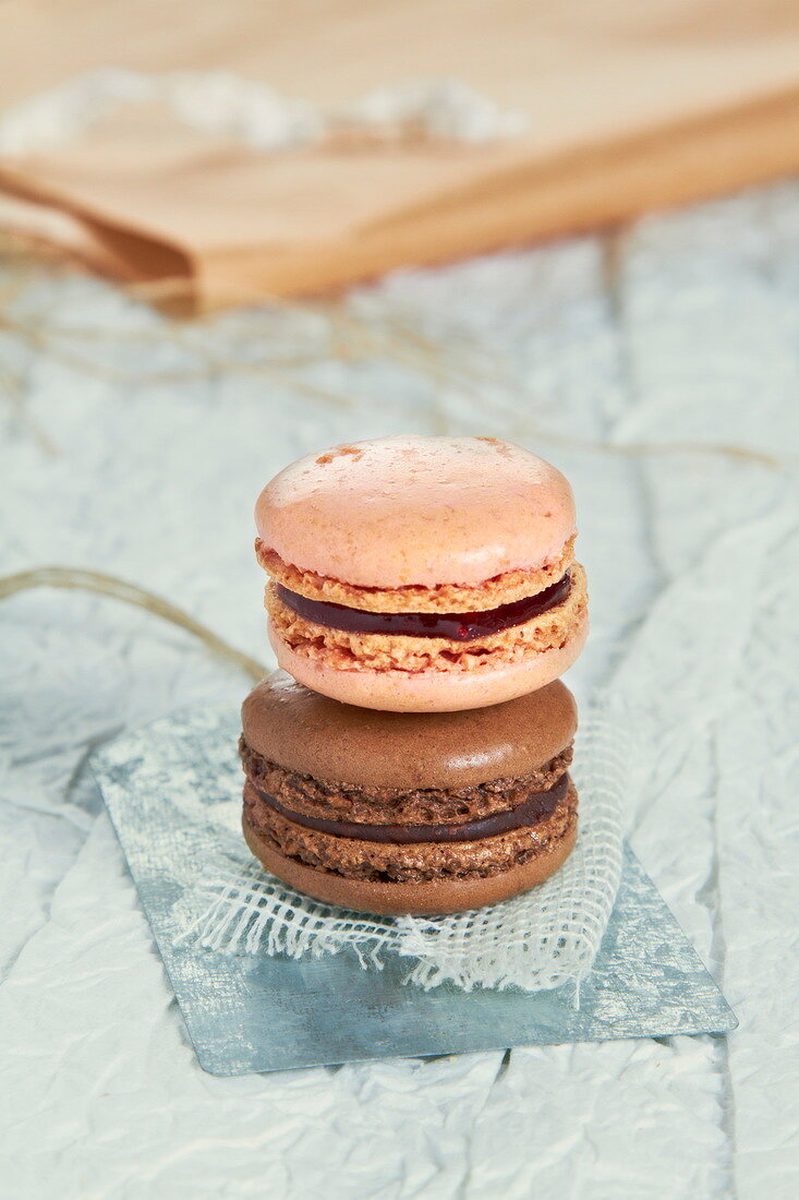 A strawberry and a chocolate macaroon