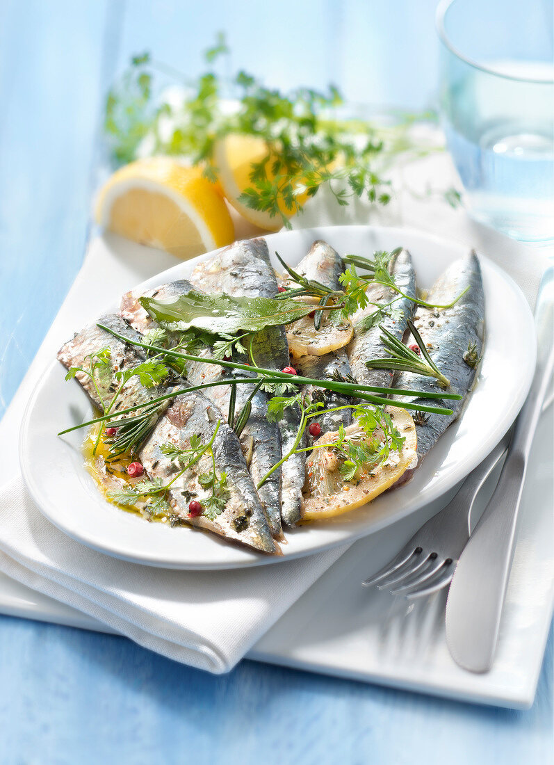 Raw sardines marinated with lemon and herbs