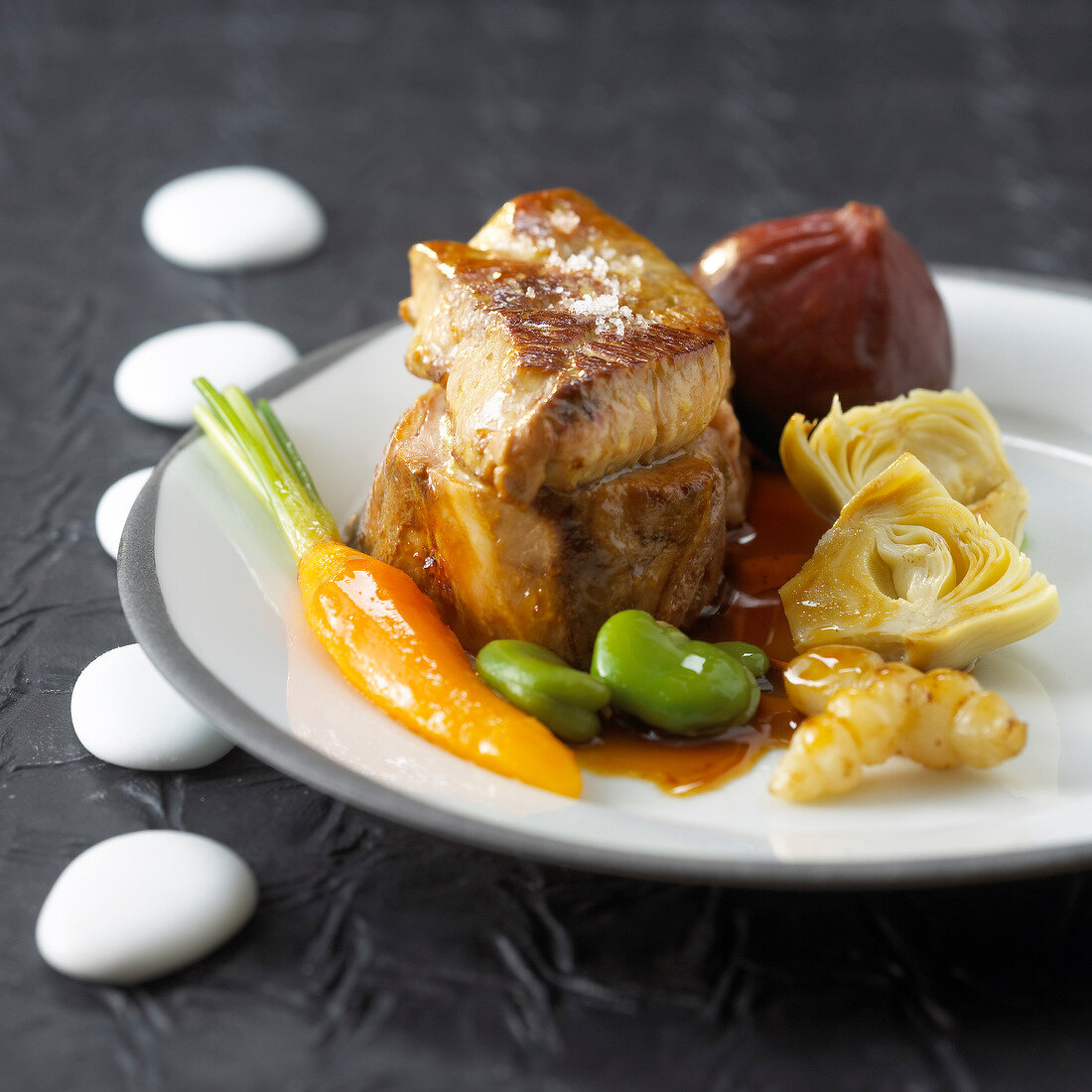 Veal Medaillon with foie gras,mixed vegetables and figs
