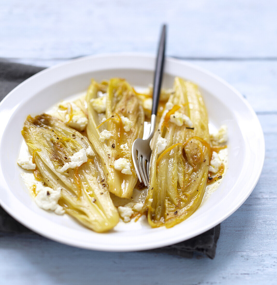 Braised chicory with crumbled Fromage frais and orange