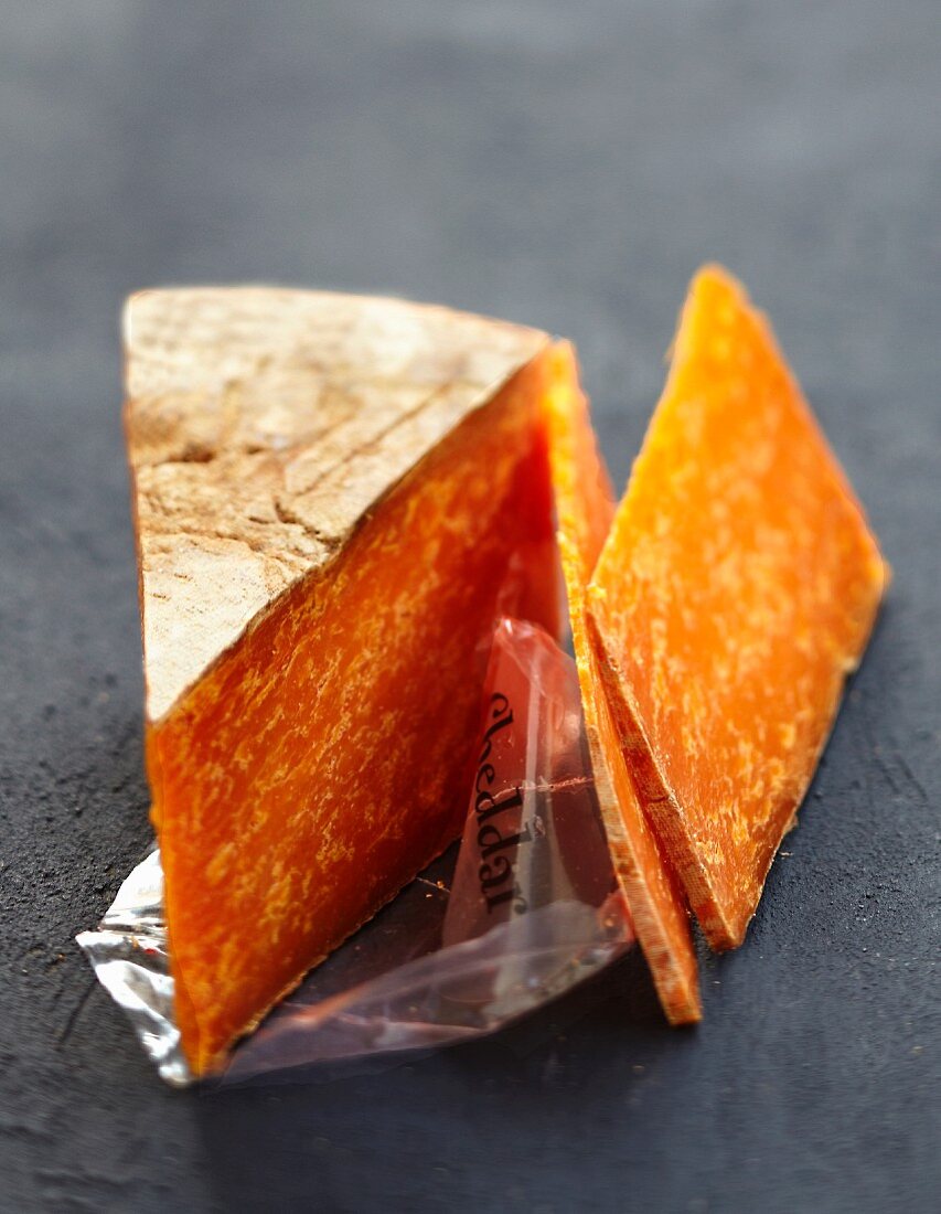 Portion and slices of Cheddar