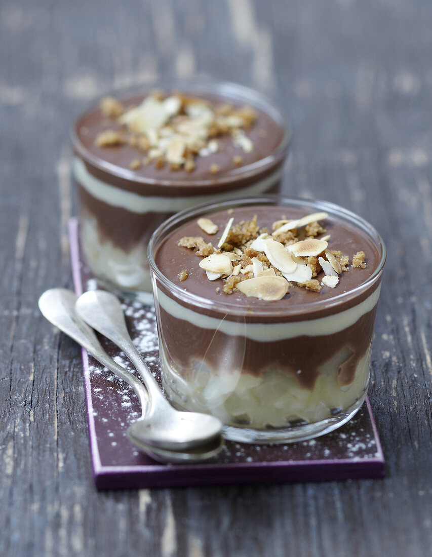 Pear and chocolate dessert sprinkled with thinly sliced almonds