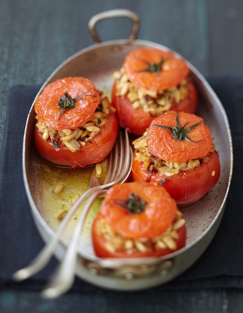 Tomatoes stuffed with chicken,pine nuts and onions