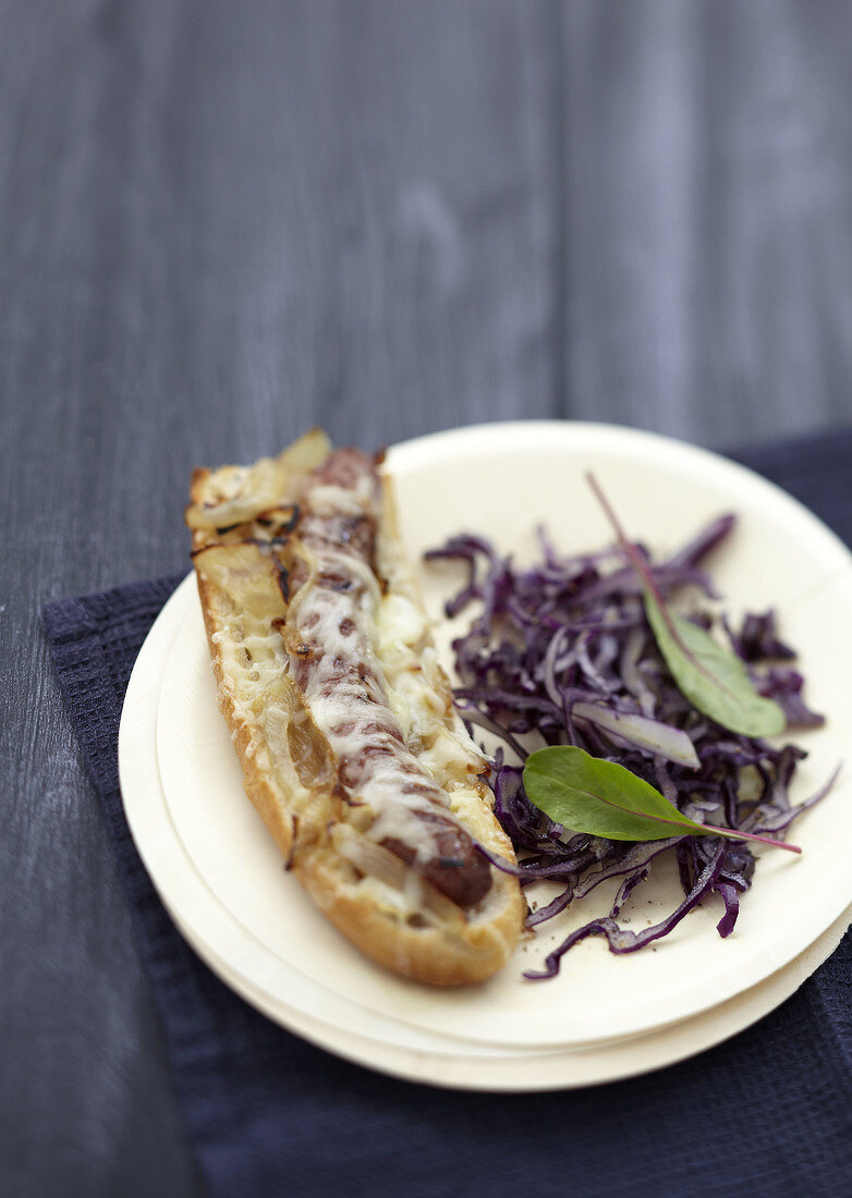Chipolata and onion open sandwich grilled with Gruyere