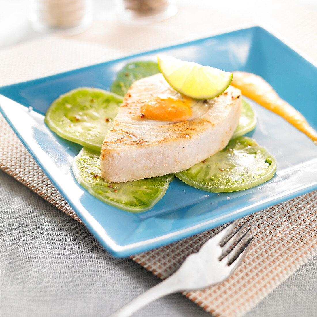 Pan-fried swordfish and thinly sliced stiped green tomatoes
