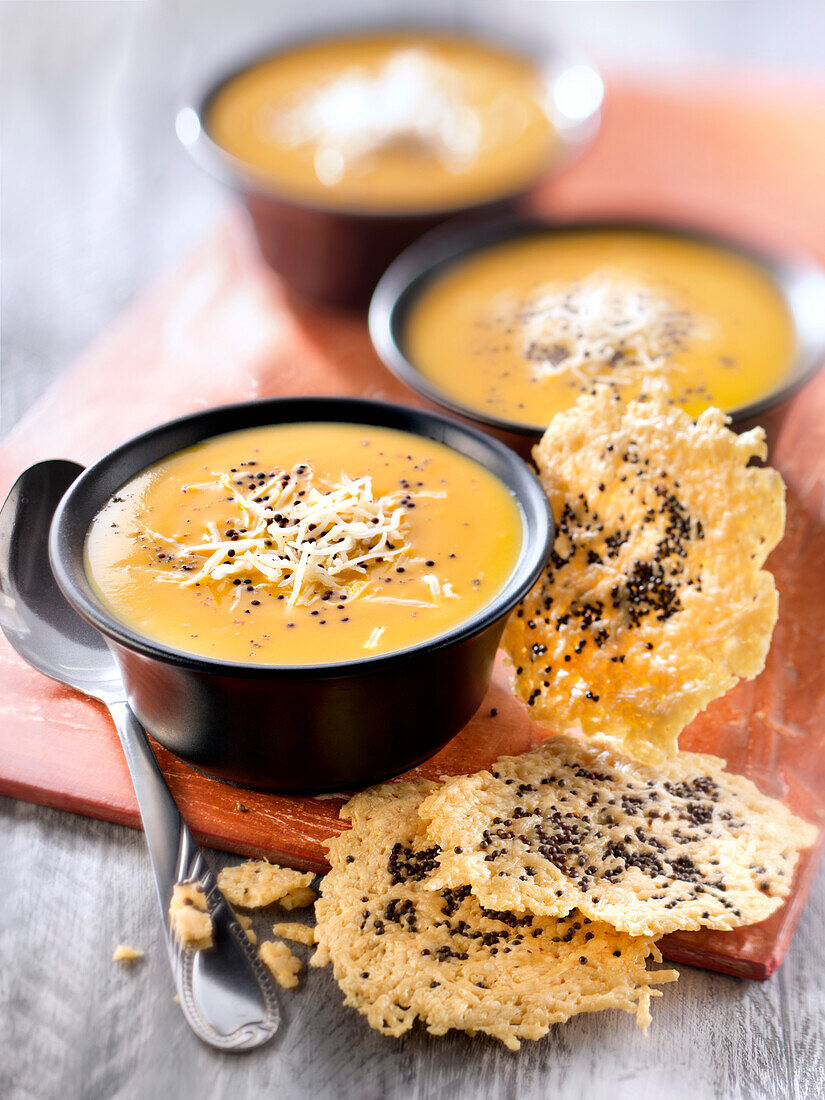Cream of pumpkin soup with Emmental tuile and mustard seed tuiles