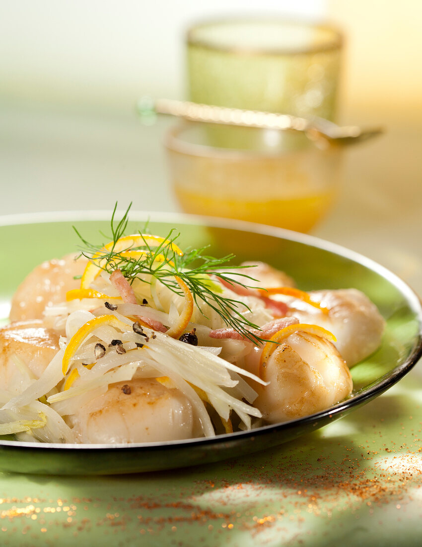 Pan-fried scallops on a bed of fennel sauerkraute and citrus fruit sauce