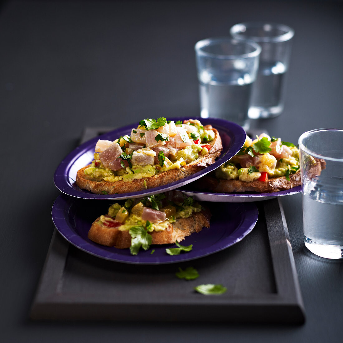 Guacmole, tuna tartare and confit citrus open sandwiches