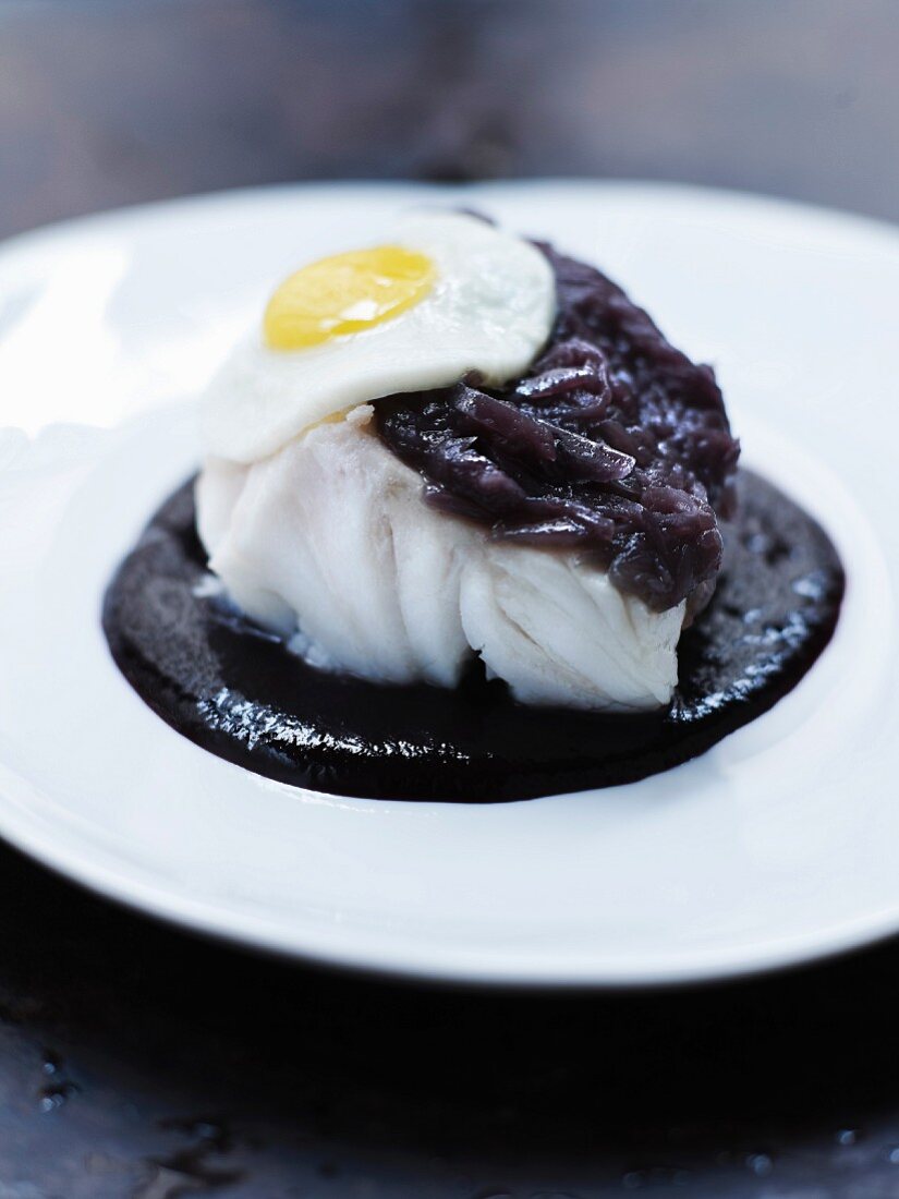 blue ling fish with stewed red onions,quail's eggs and spicy hot red wine sauce