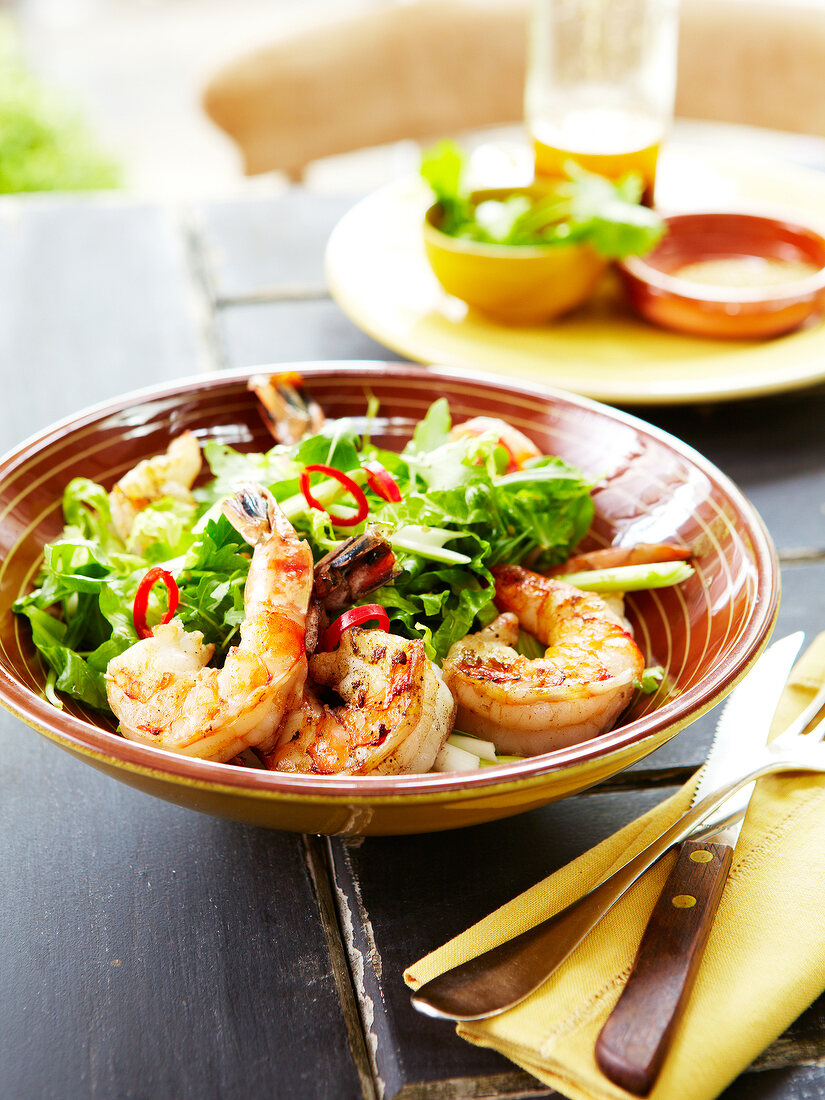 Sauteed gambas with salt and pepper,celery stalks and fresh red hot pepper