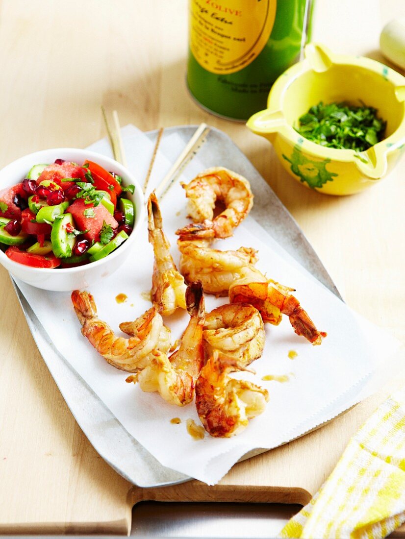 Crisp shrimps marinated in soya sauce and garlic.cucumber,tomato,watermelon and pomegranate salad