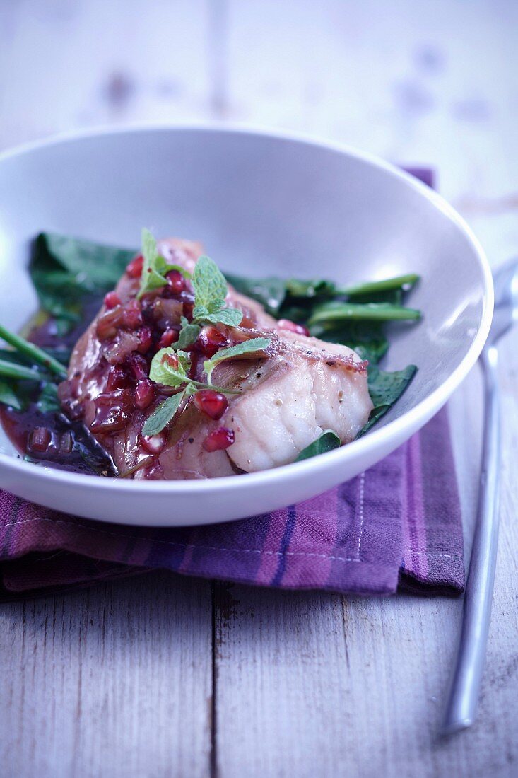 Cod with pomegrante,fresh spinach and mint
