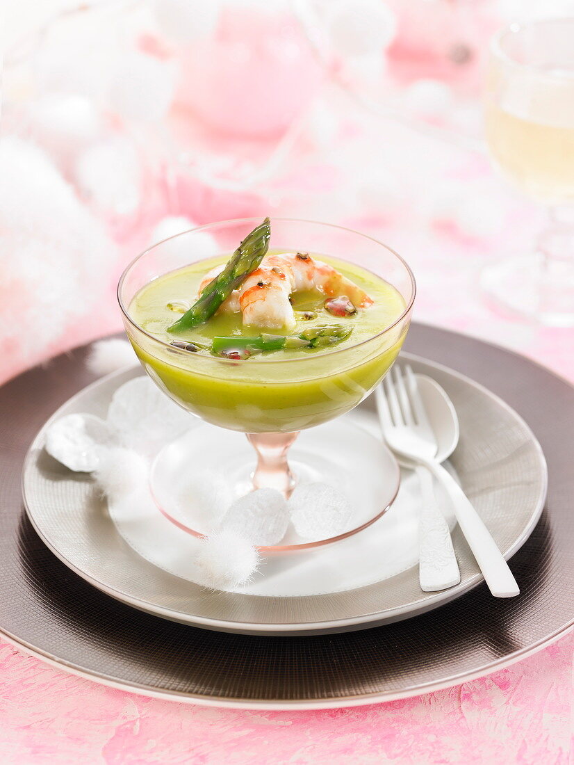 Cream of green asparagus with grilled king prawns and hot pepper oil