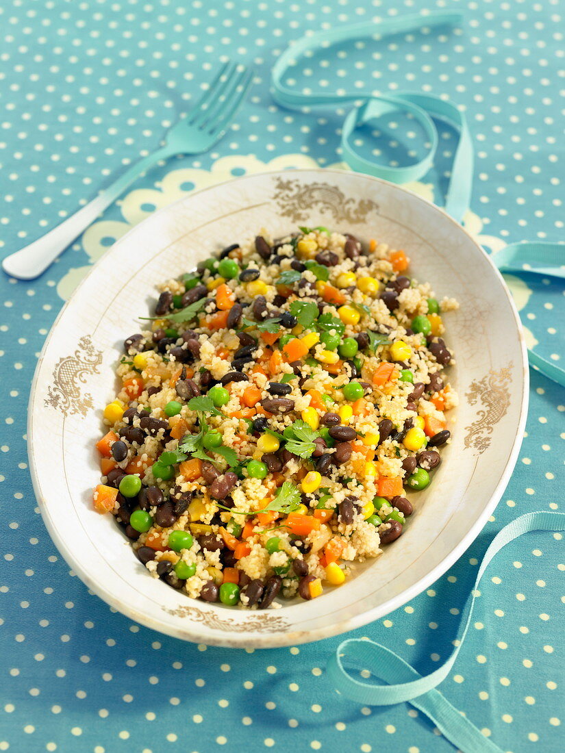 Semolina with peas, sweet corn, carrots and black beans
