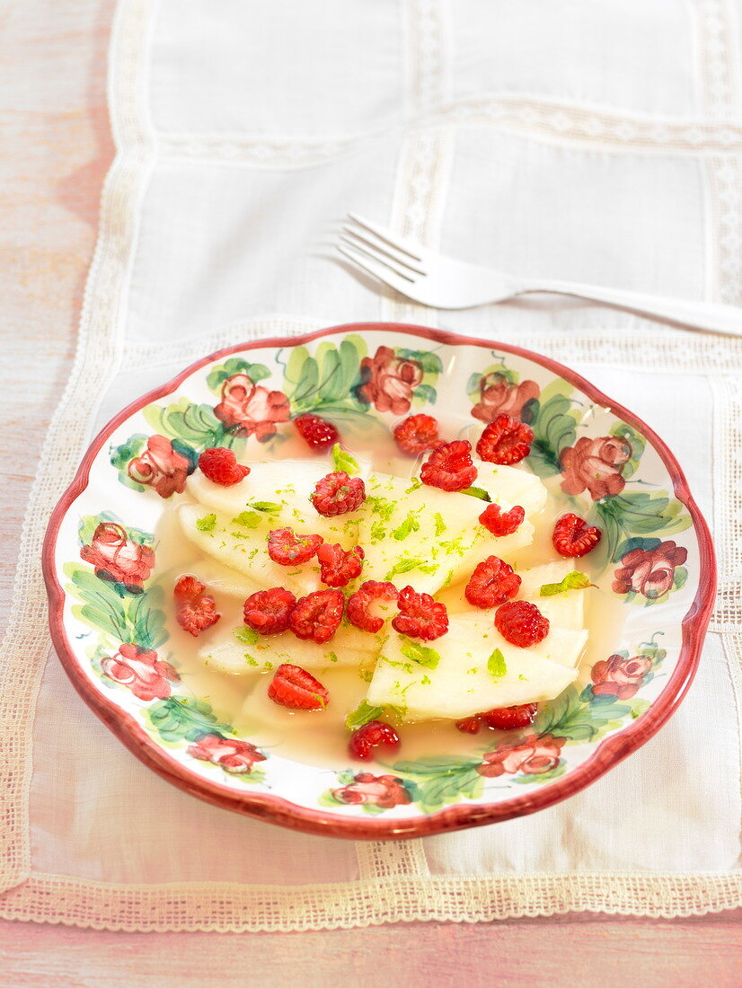 Melon soup with raspberries and lime zests