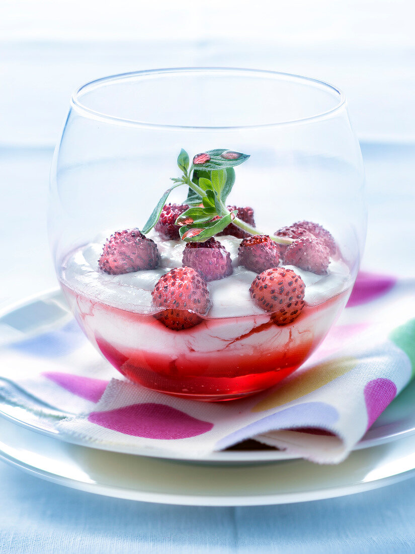 Fontainebleau with wild strawberries and pomegranate syrup
