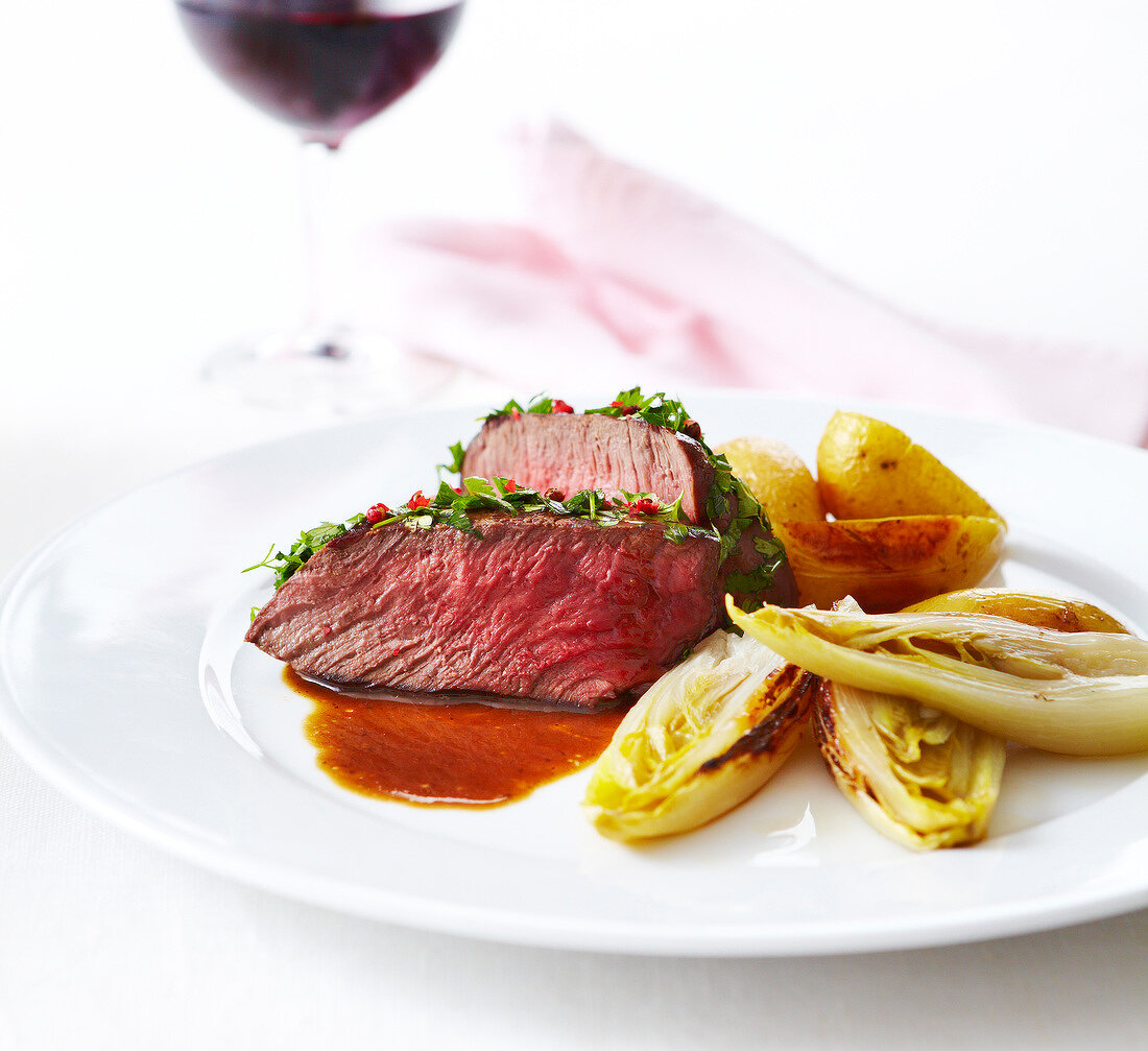 Roast beef with herbs and gravy,braised chicory