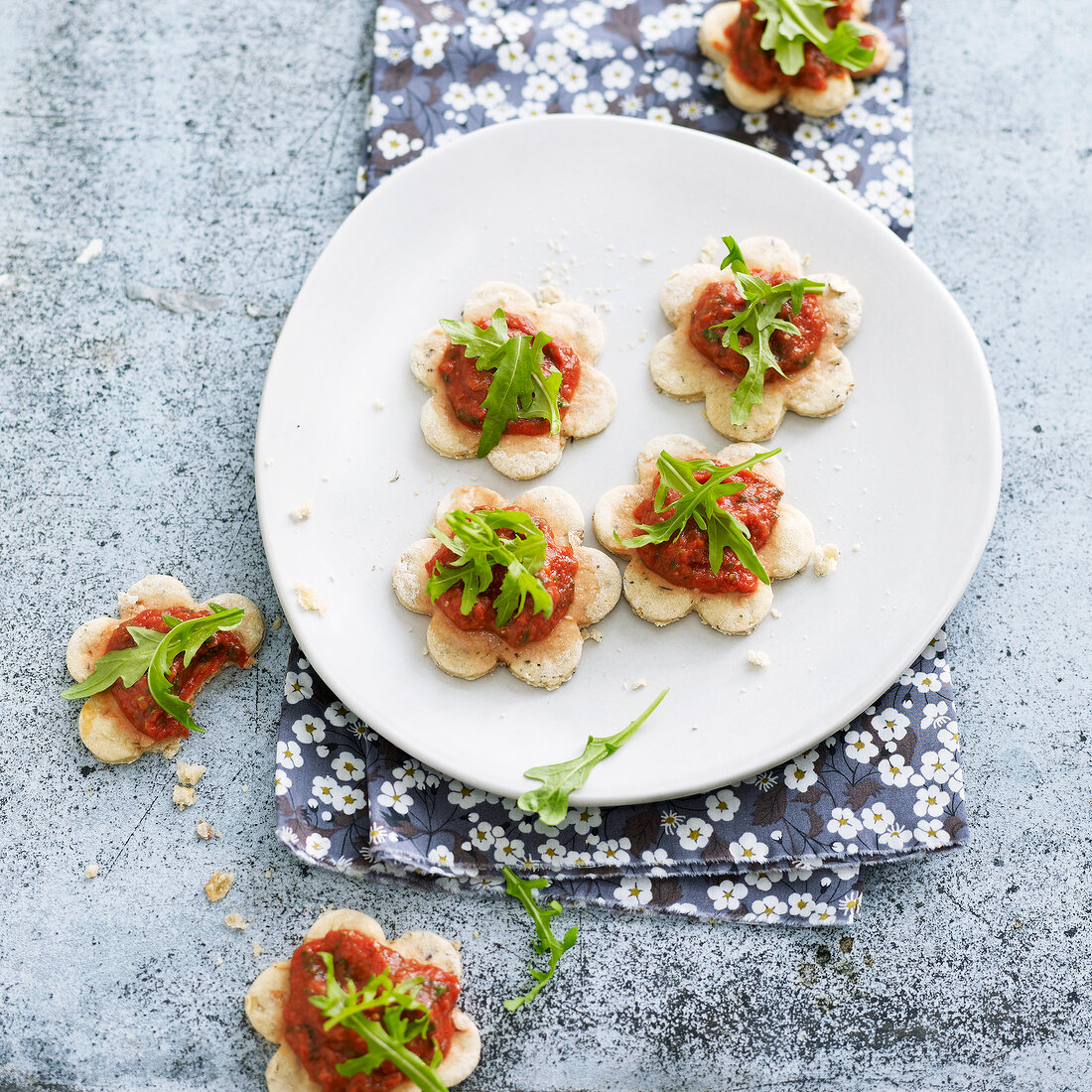 Crisp oatmeal croquants topped with tomato sauce