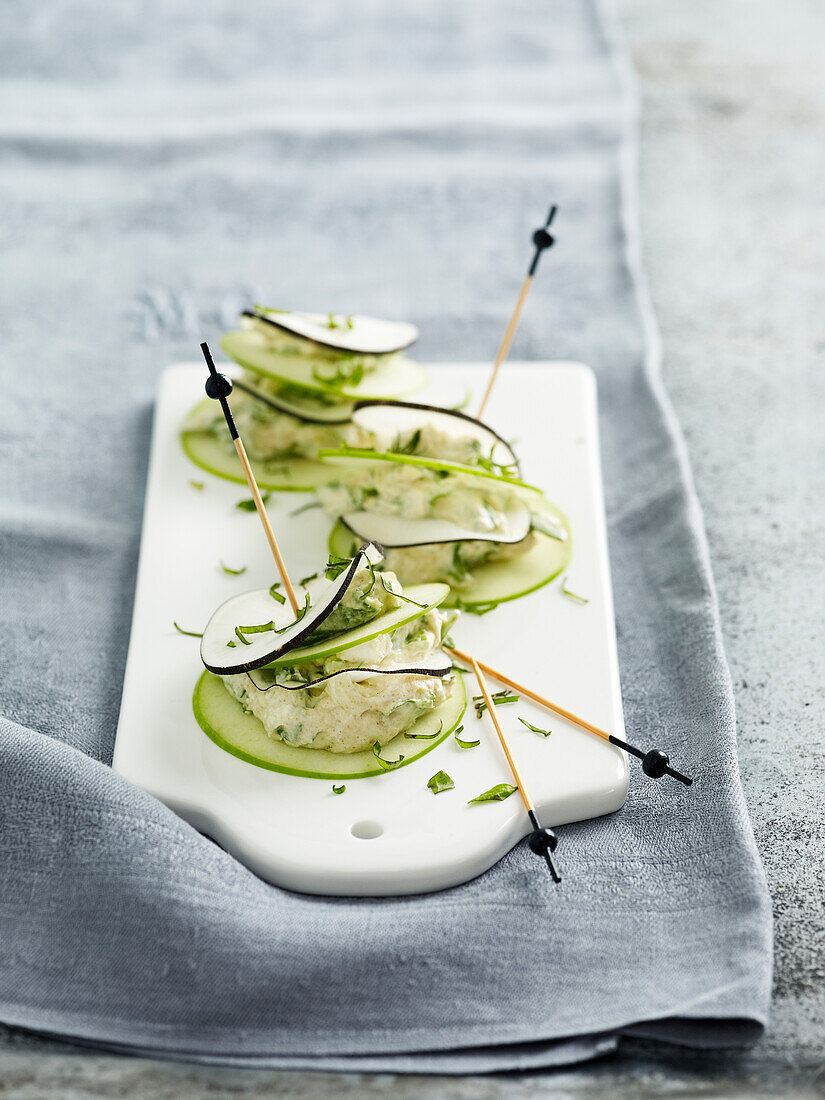 Thinly sliced black radish and apple and goat's cheese Mille-feuille