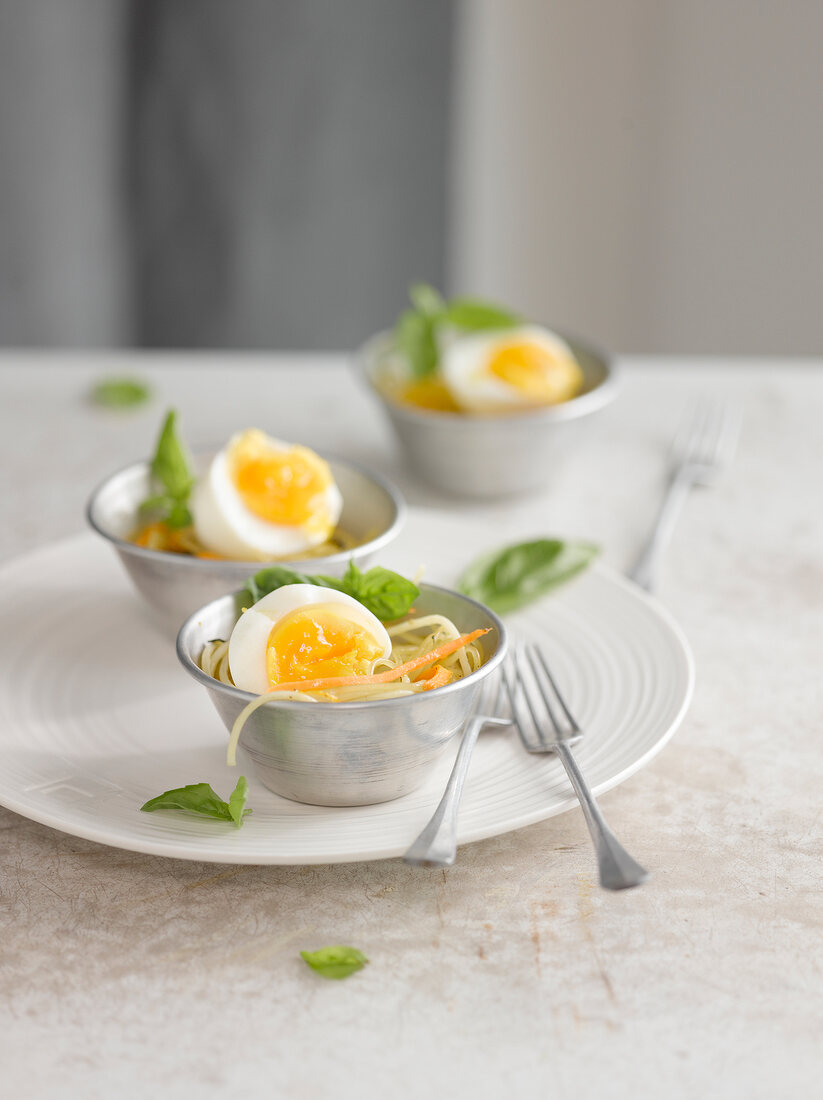 Hard-boiled eggs on a bed of spaghettis