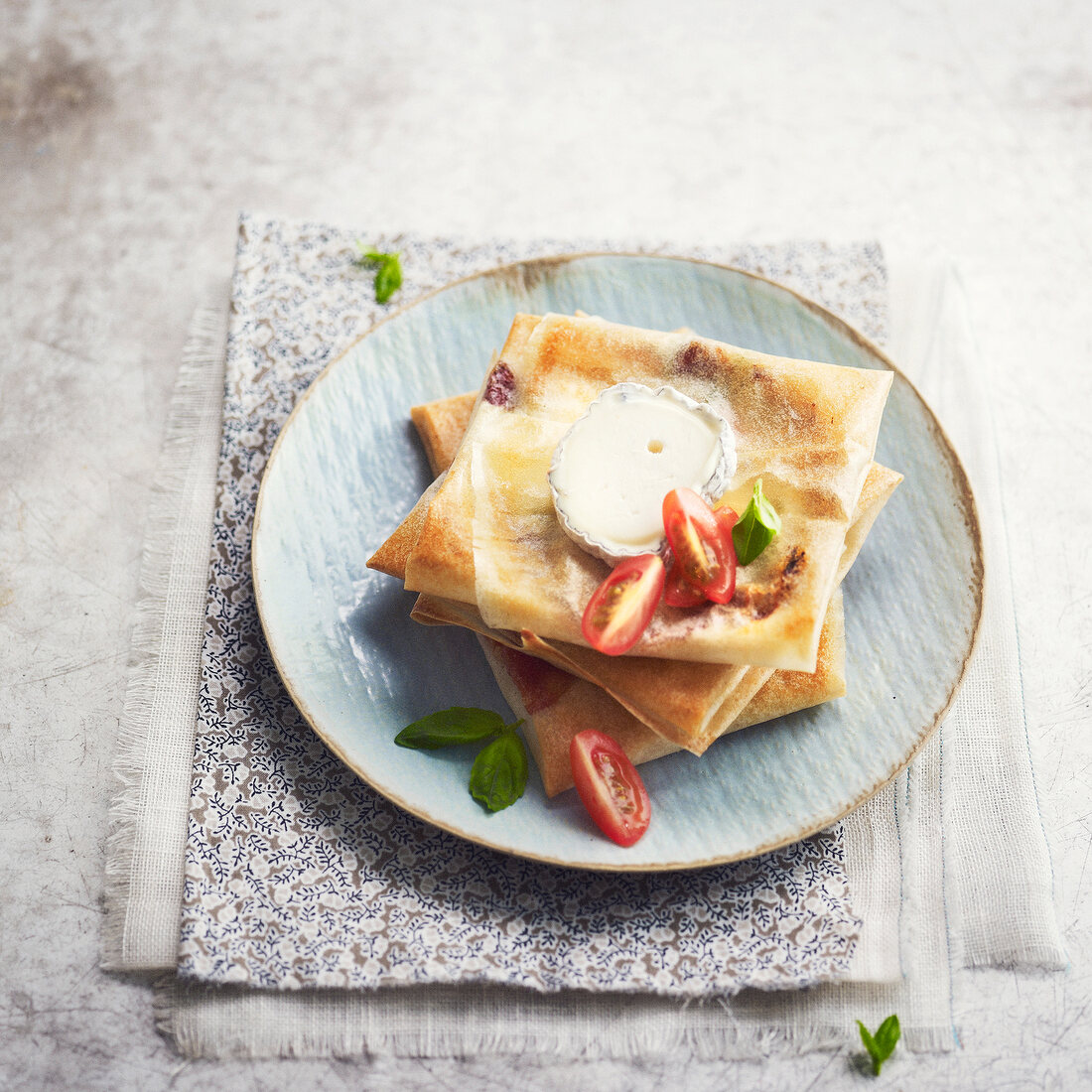 Goat's cheese and tomato filo pastry squares