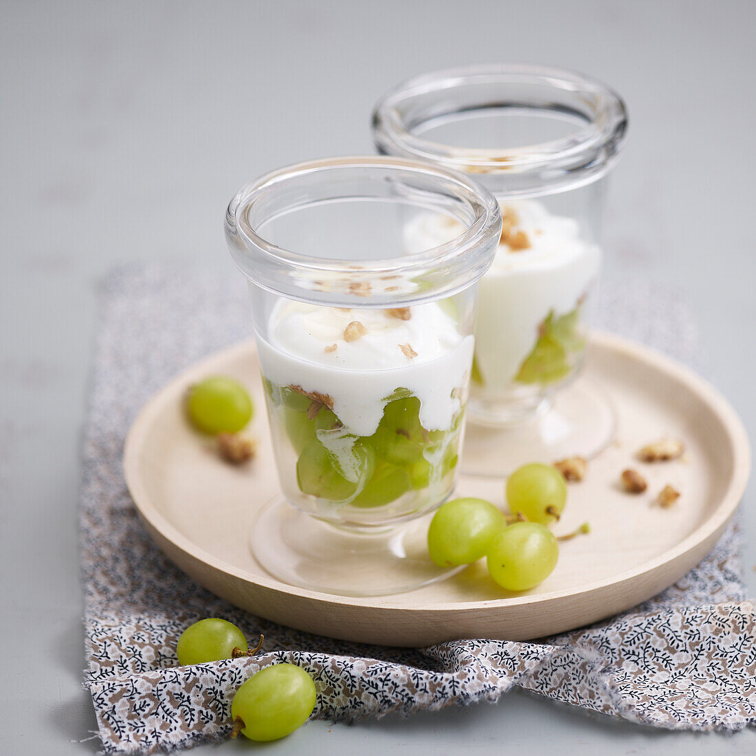 Green grapes topped with cream and walnuts