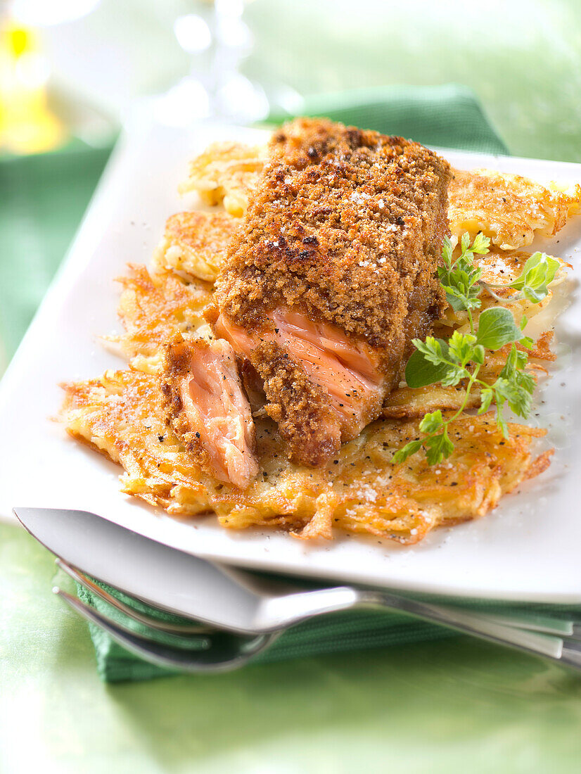 Salmon with gingerbread crust on hash browns