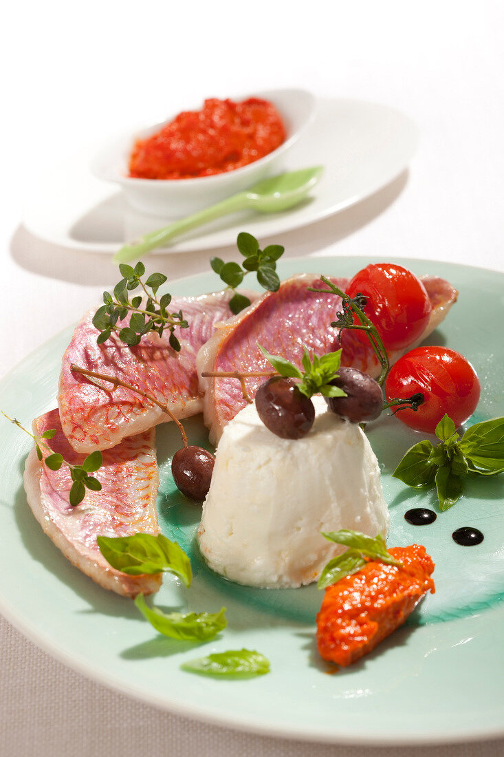 Goatfish fillets with cream cheese, olives and red tomato tapenade