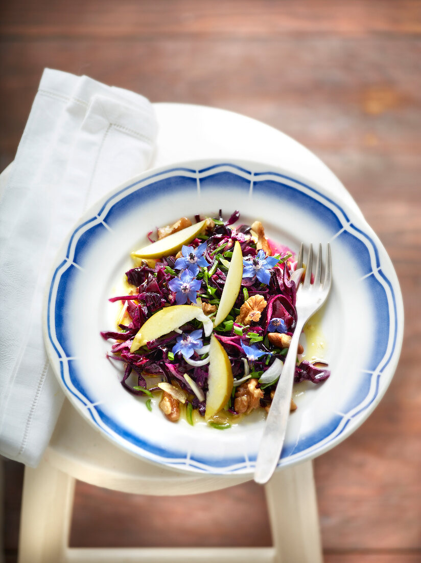 Red cabbage, walnut, borage flowers and apple salad