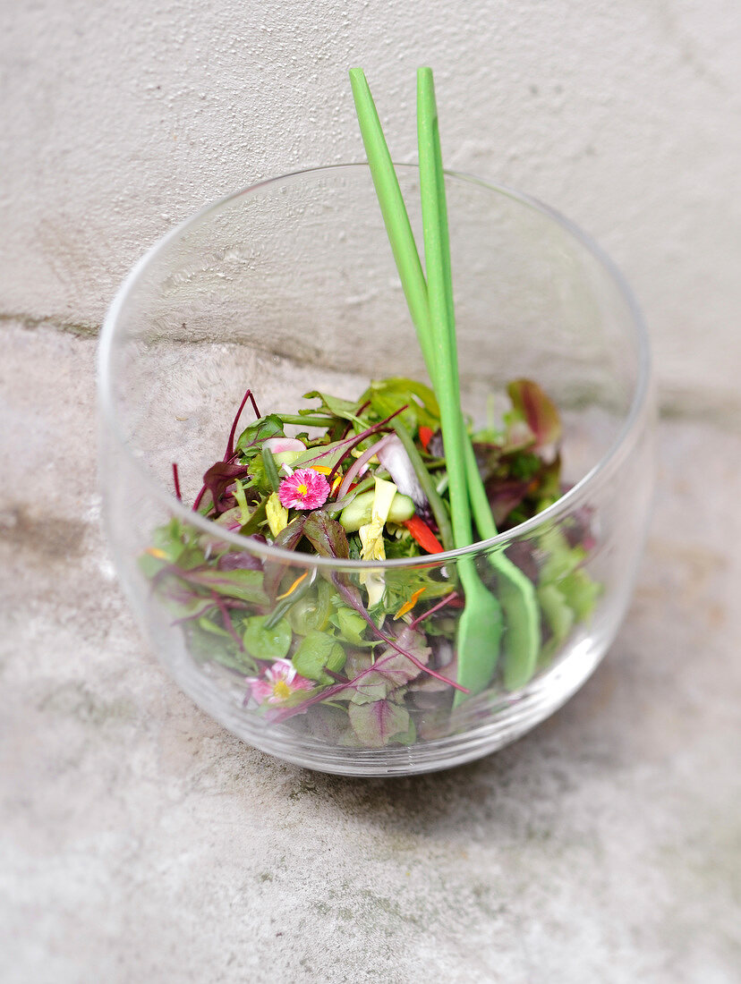 Fancy salad in a large transparent bowl