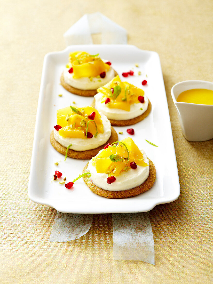 Faiselle tartlets topped with mango,pomegranate,lime and pistachio
