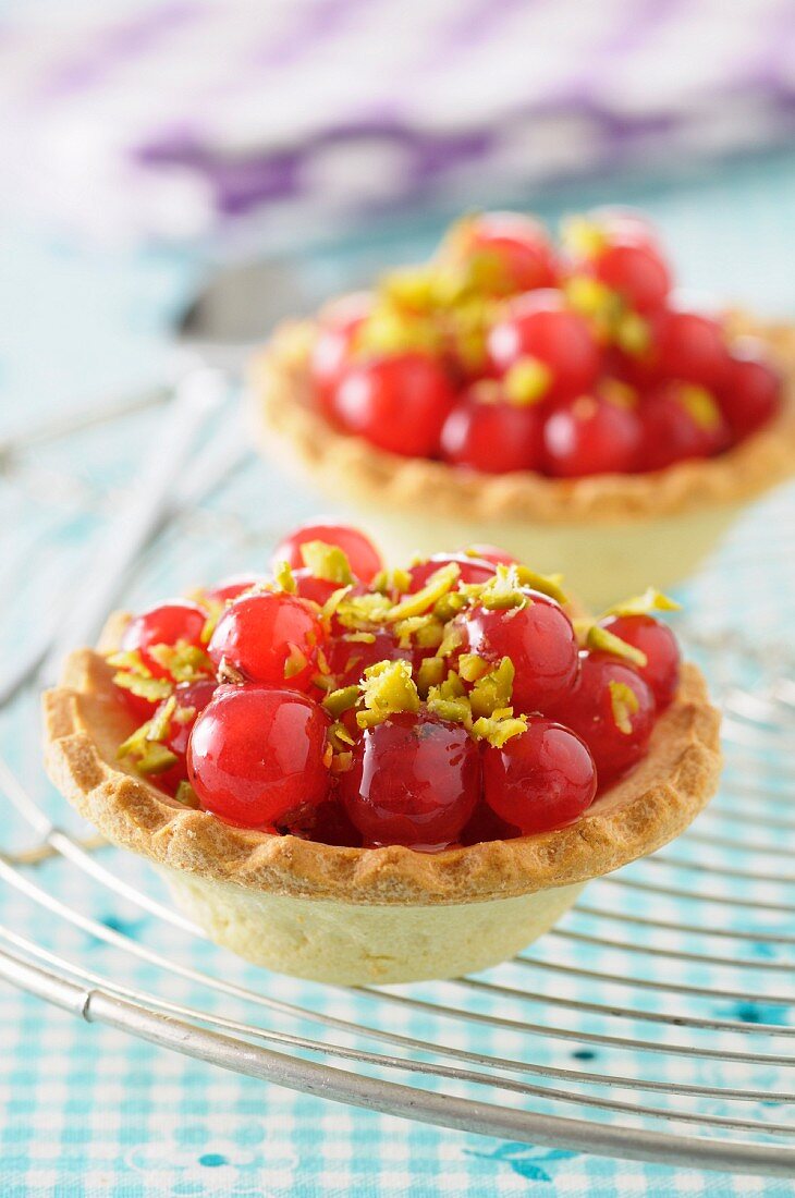 Redcurrant and crushed pistachio tartlets