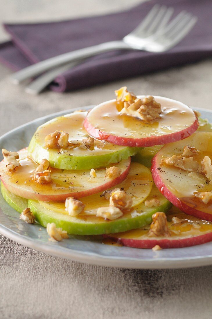 Thinly sliced apples with honey and walnuts