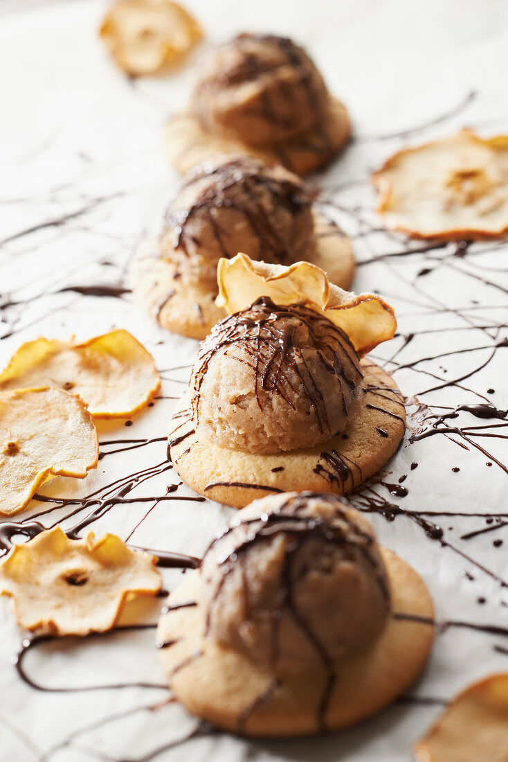Shortbreads topped with chestnut ice cream, runny chocolate and potato chips