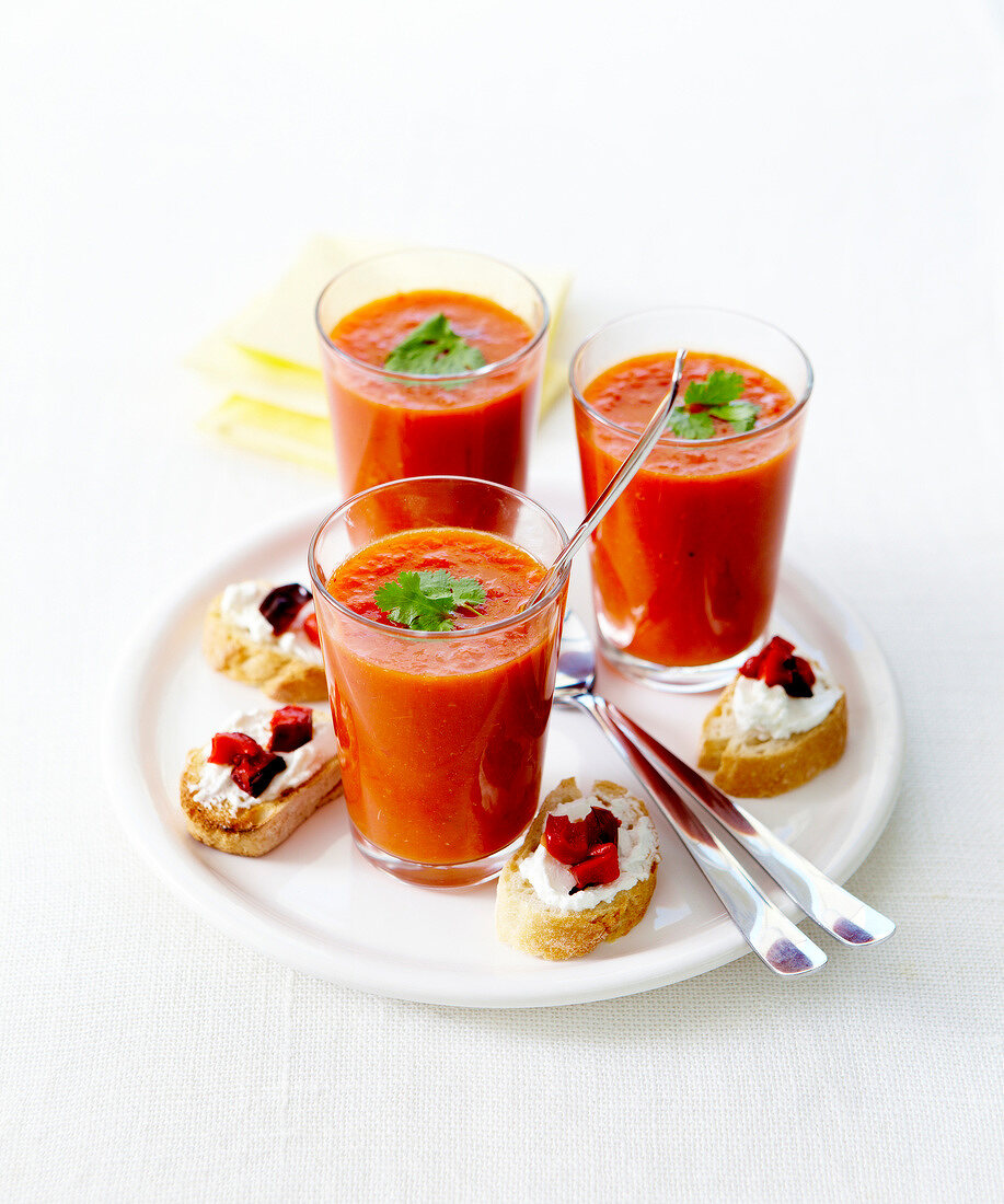 Red roasted tomato soup,cream cheese and diced peppers on sliced baguette