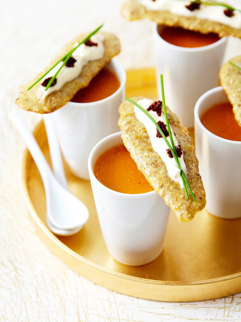 Lobster bisque,sesame crackers garnished with cream and lumpfish roe