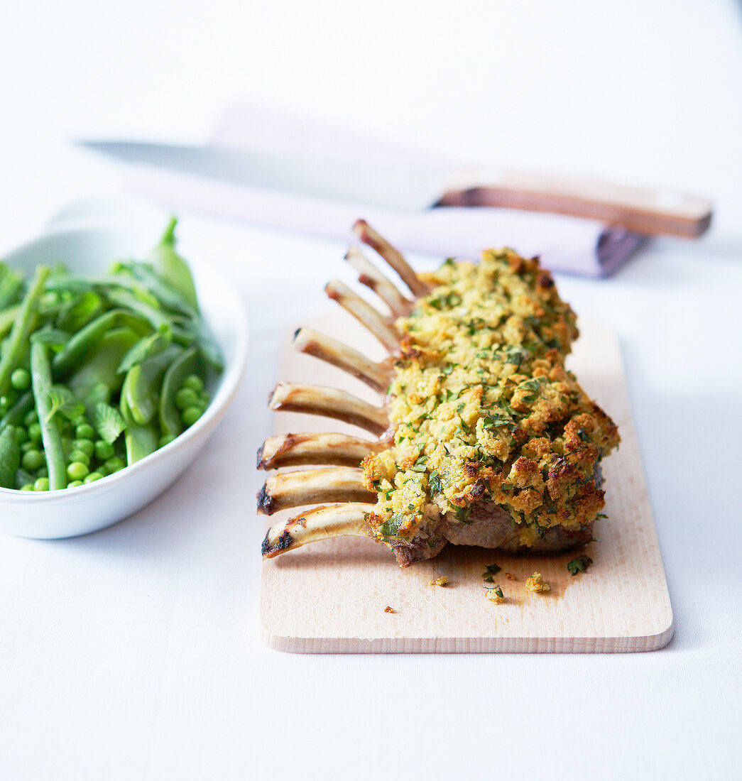 Rack of lamb in mustard and parsley crust with green spring vegetables