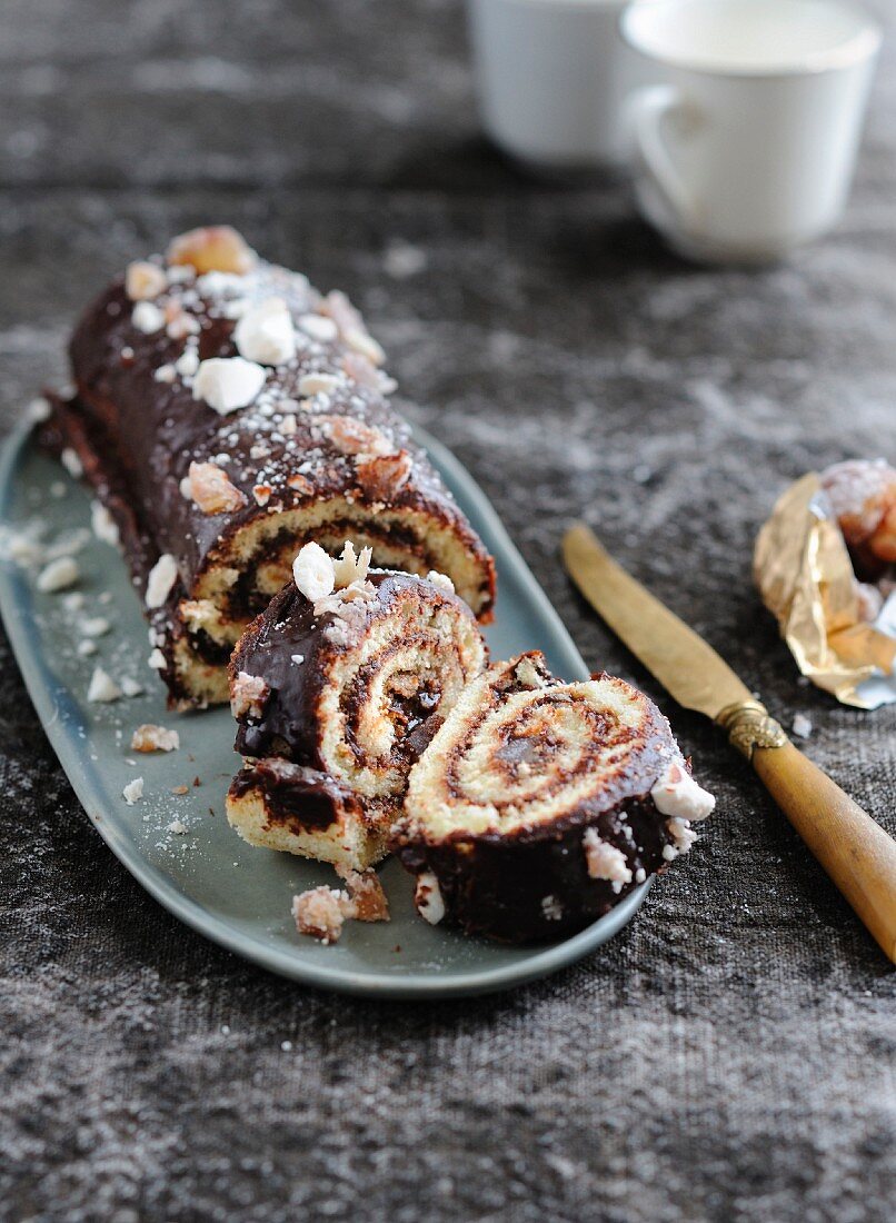 Chestnut cream rolled log cake coated with crushed meringues