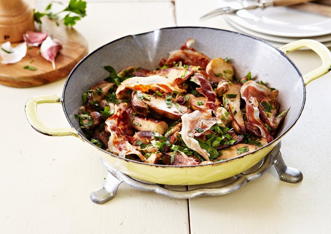 Pan-fried ceps with garlic,herbs and crisp bacon
