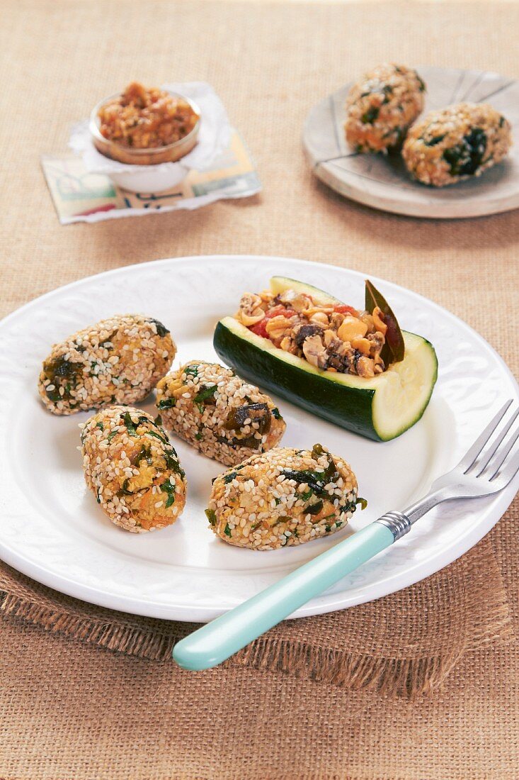 Stuffed zucchini wedges and mussel sesame seed balls