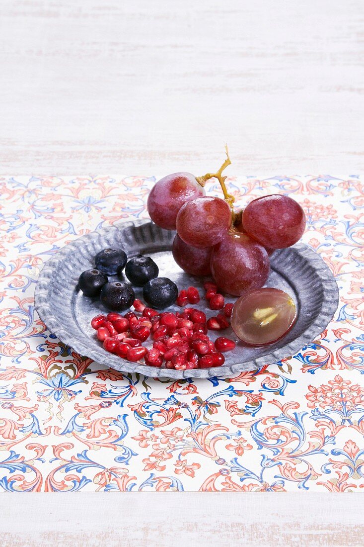 Pomegranate seeds,blueberries and grapes